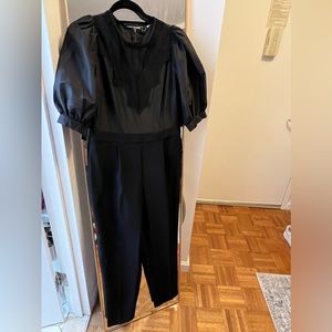 Express jumpsuit with taffeta puff sleeve and lace detail. NWT size Medium
